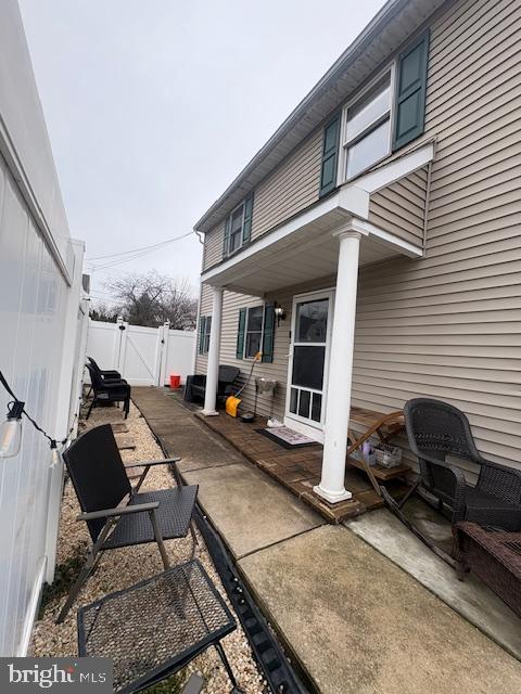 219 Connor Street Norristown, PA 19401 - Photo 5 of 38 a view of a patio with table and chairs and wooden floor