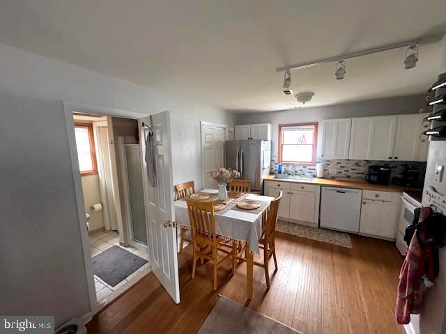 219 Connor Street Norristown, PA 19401 - Photo 7 of 38 a kitchen with a table chairs refrigerator and cabinets