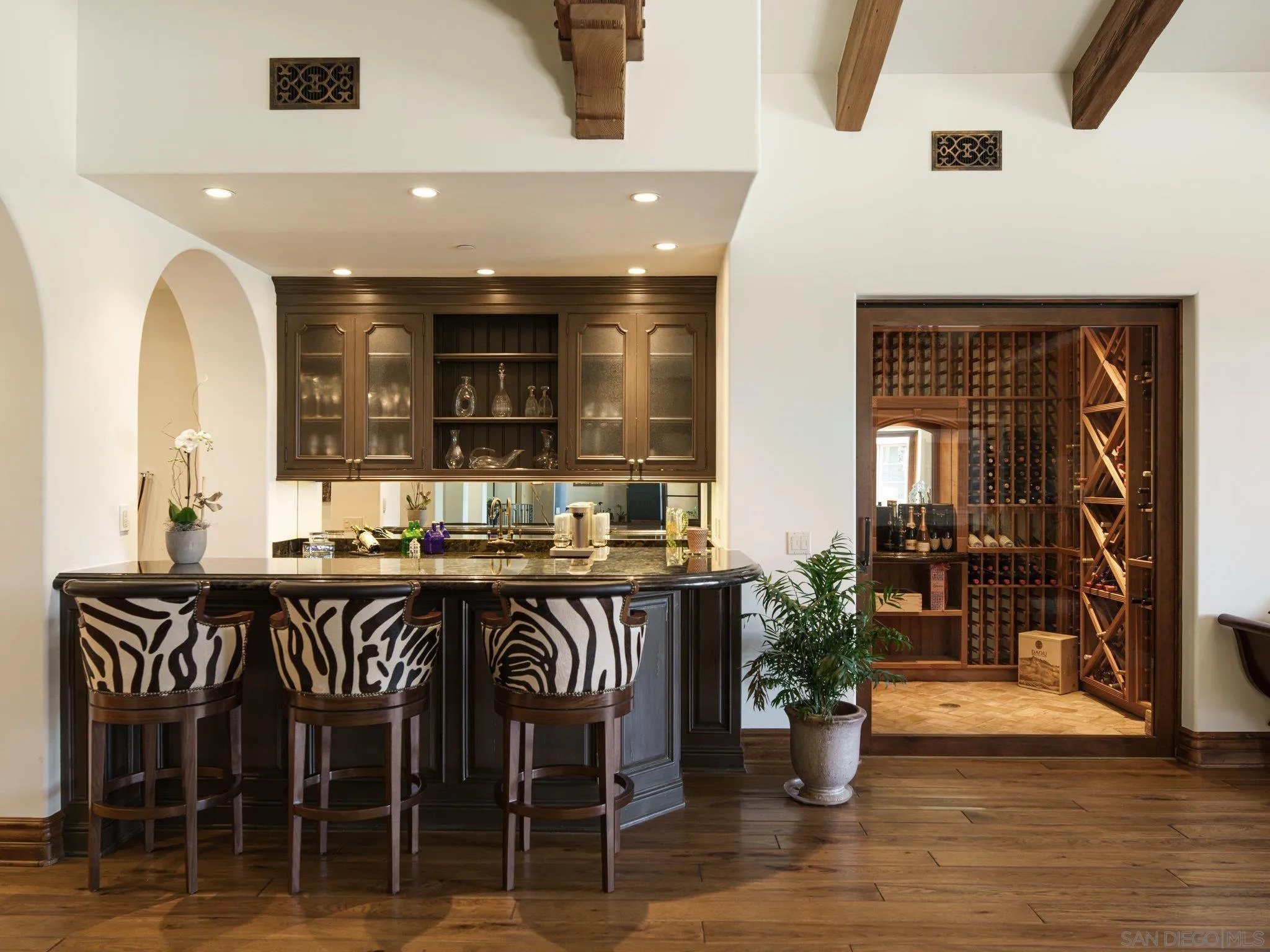 16409 Via De Santa Fe Rancho Santa Fe, CA 92067 - Photo 15 of 41 a kitchen with a table and chairs in it