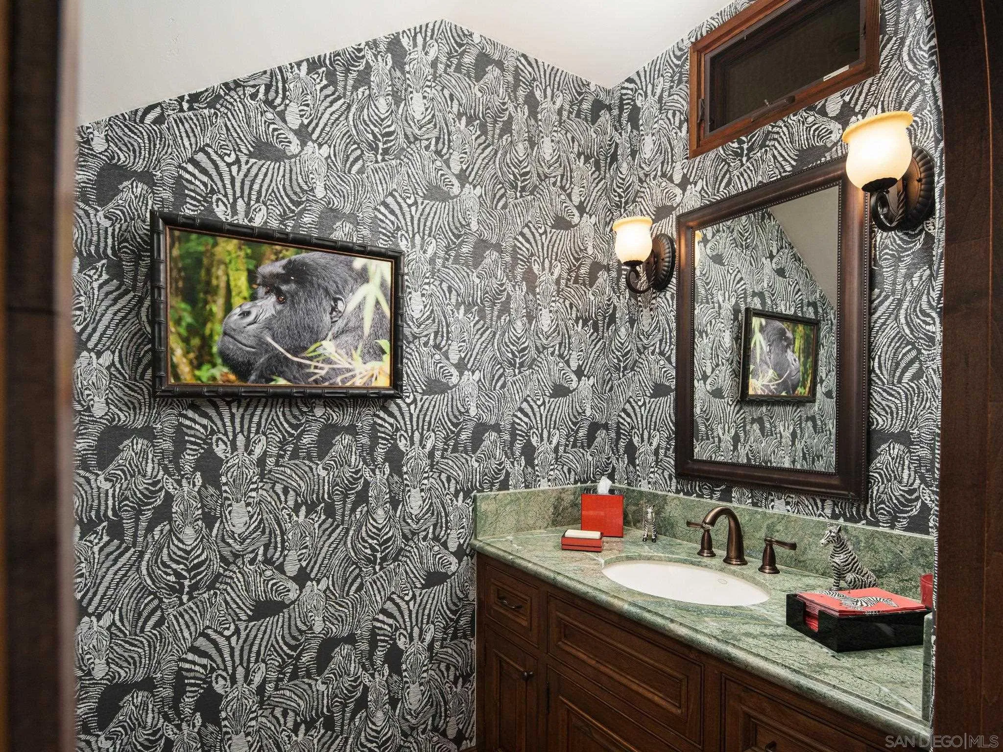16409 Via De Santa Fe Rancho Santa Fe, CA 92067 - Photo 18 of 41 a bathroom with a sink and a mirror