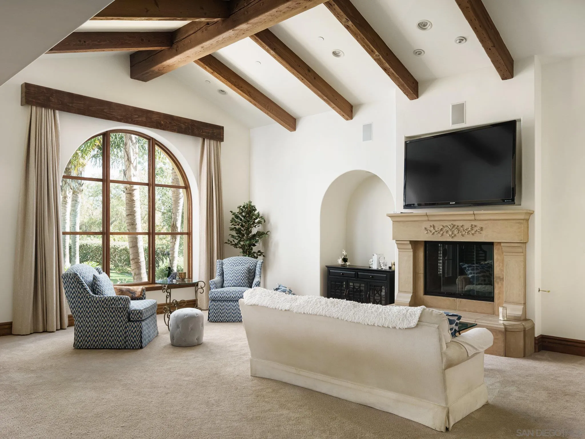 16409 Via De Santa Fe Rancho Santa Fe, CA 92067 - Photo 20 of 41 a living room with furniture a fireplace and a flat screen tv