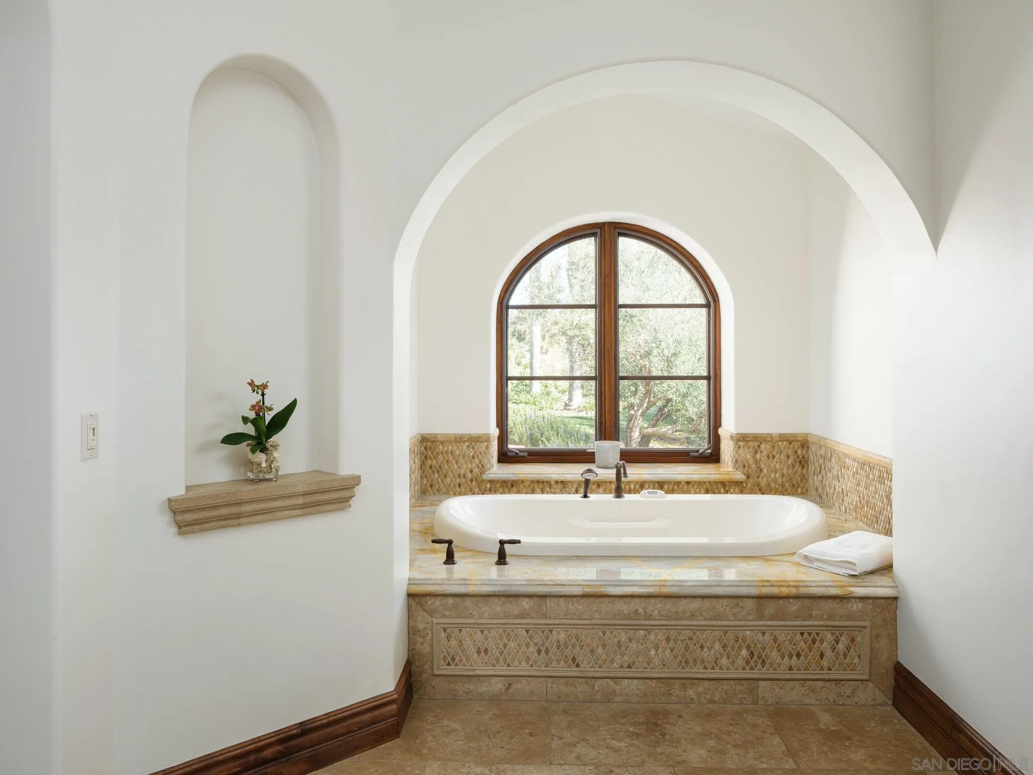 16409 Via De Santa Fe Rancho Santa Fe, CA 92067 - Photo 22 of 41 a bathroom with a bathtub and window