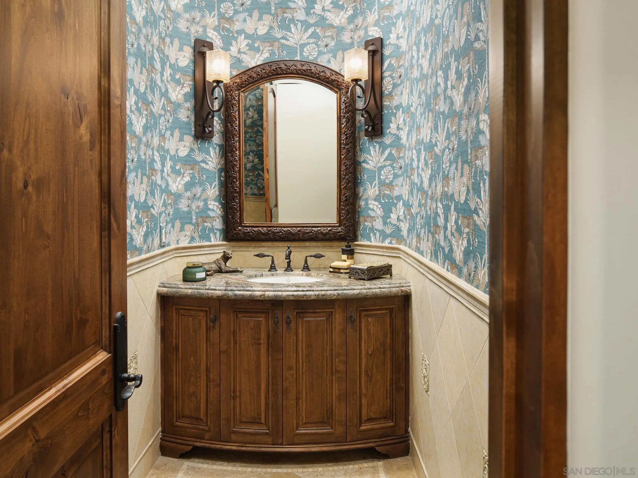 16409 Via De Santa Fe Rancho Santa Fe, CA 92067 - Photo 24 of 41 a bathroom with a granite countertop sink and a mirror