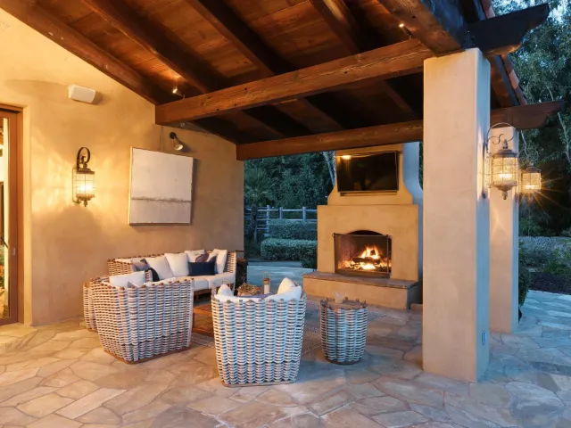a view of a swimming pool with sitting area and garden