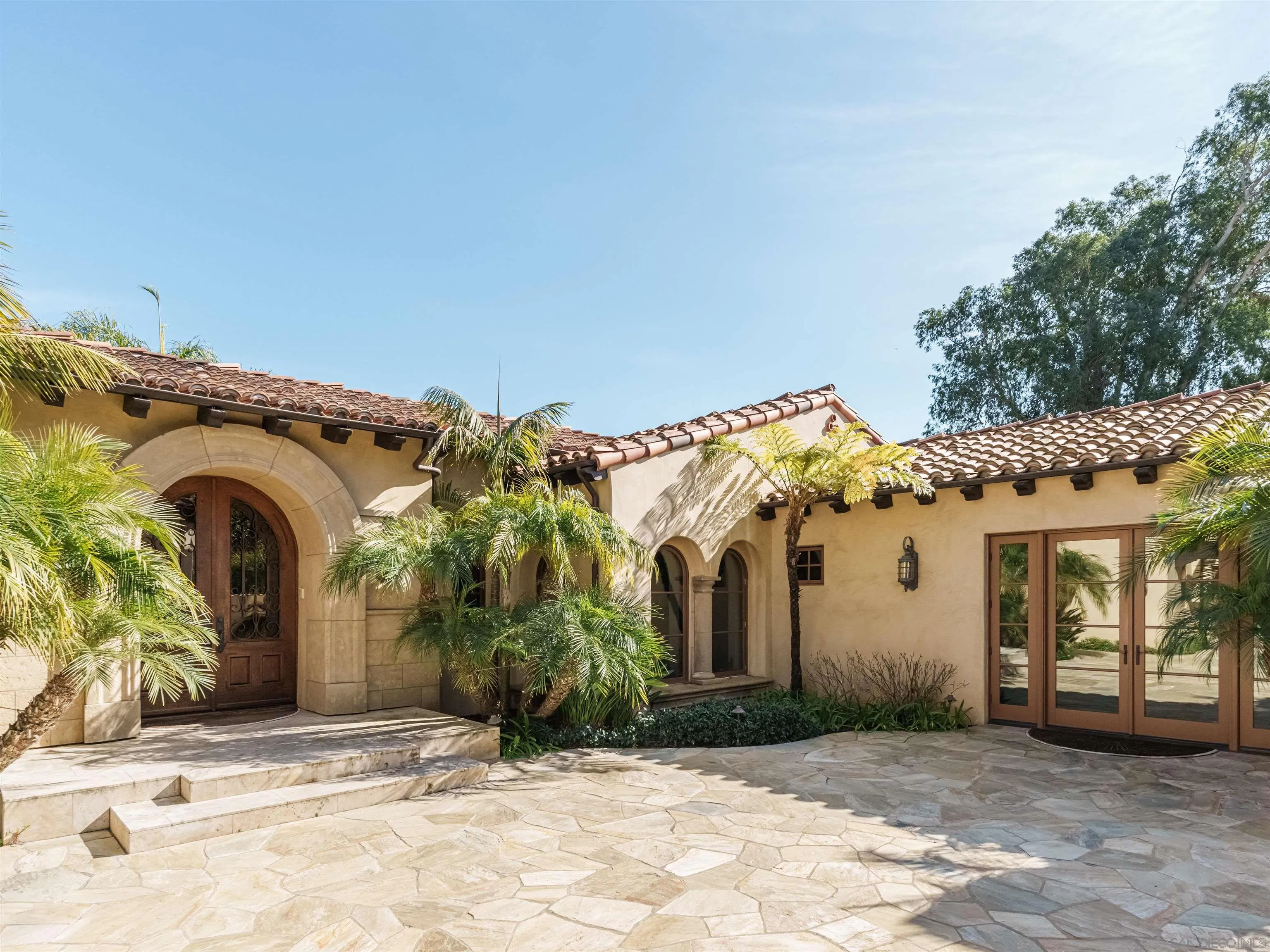 16409 Via De Santa Fe Rancho Santa Fe, CA 92067 - Photo 37 of 41 a view of a white house with a outdoor space