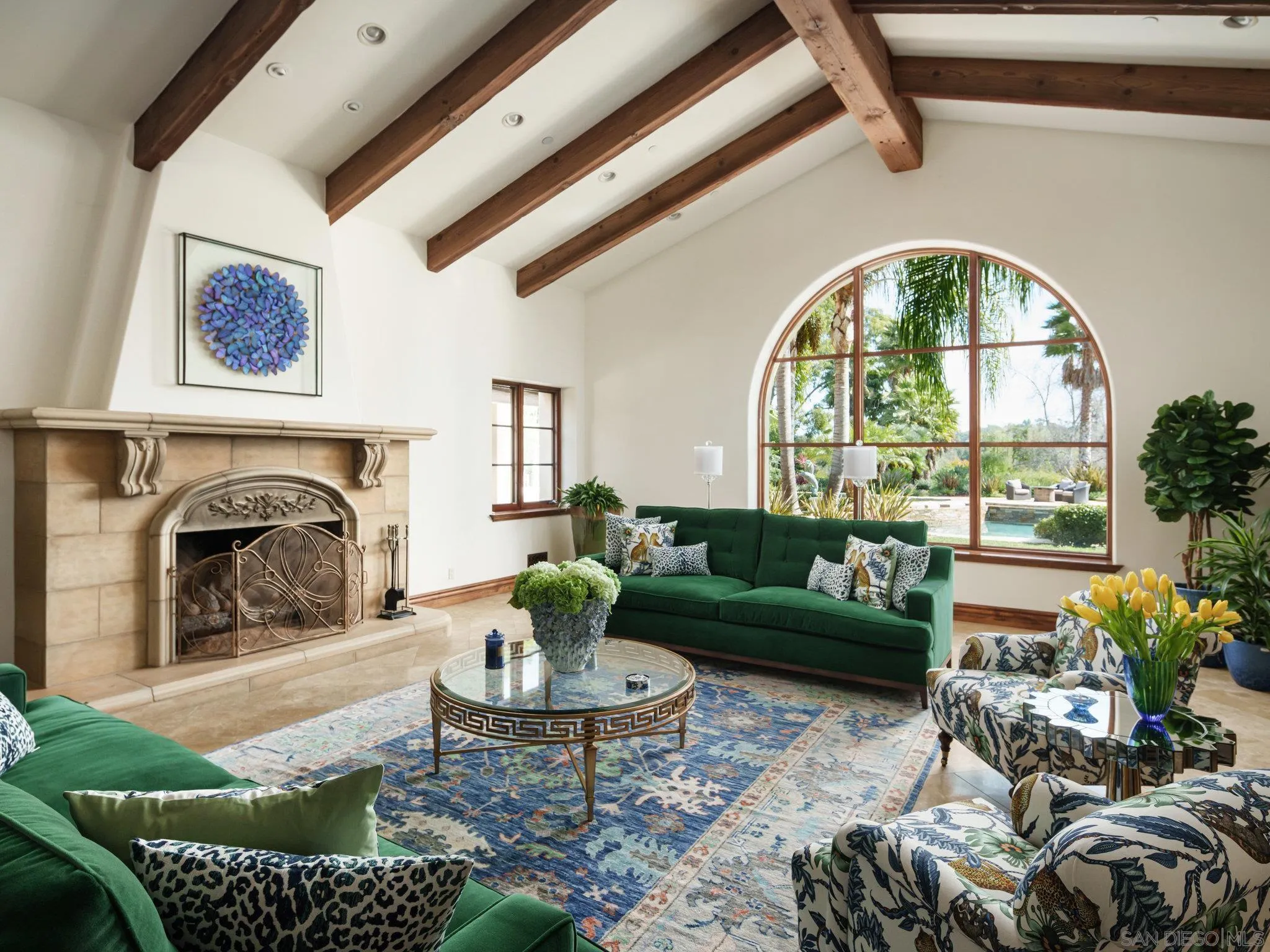 16409 Via De Santa Fe Rancho Santa Fe, CA 92067 - Photo 5 of 41 a living room with furniture fireplace and a table