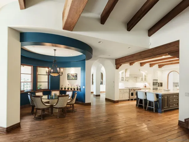 a view of a dining room with furniture and wooden floor