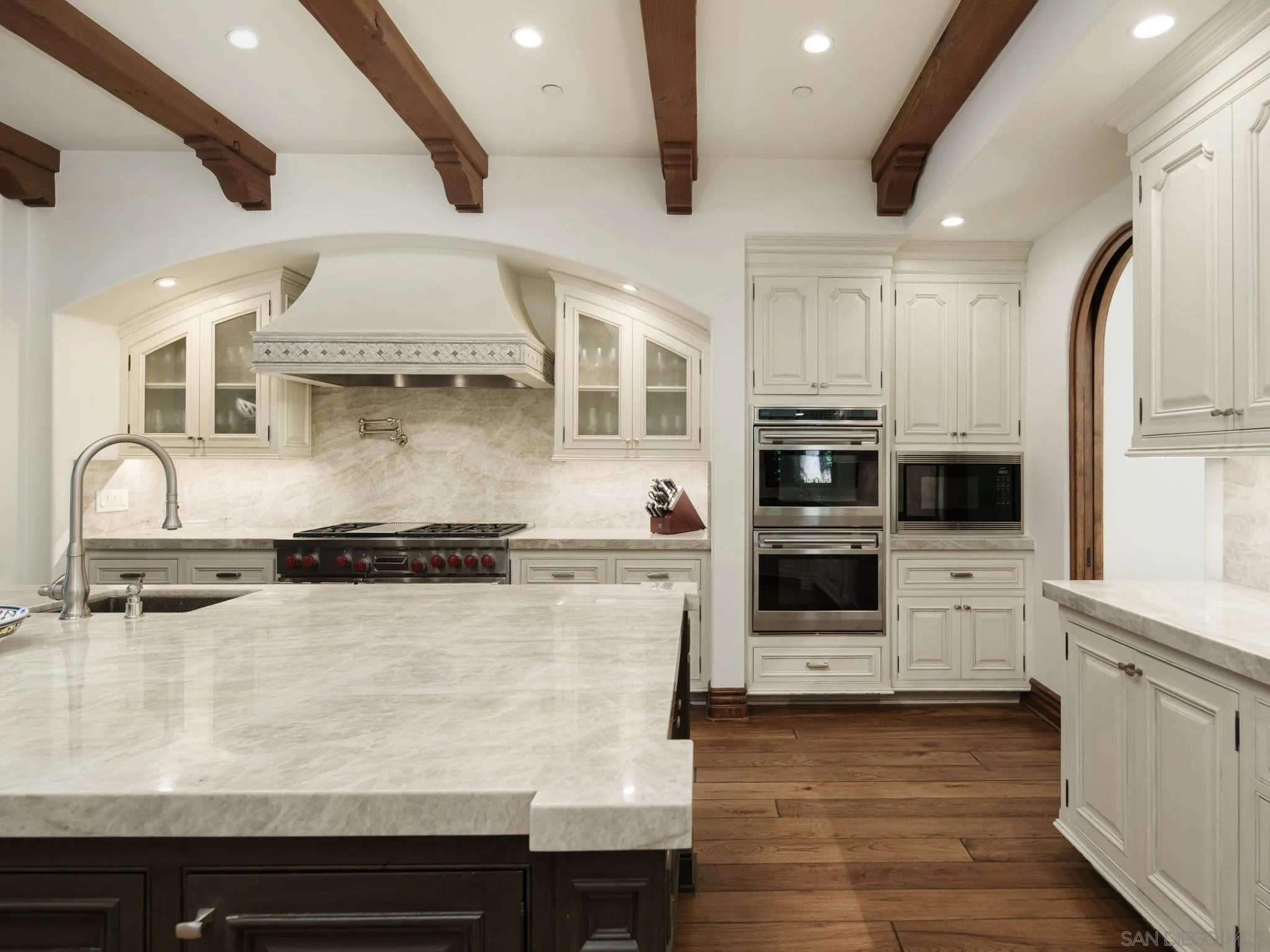 16409 Via De Santa Fe Rancho Santa Fe, CA 92067 - Photo 10 of 41 a kitchen with stainless steel appliances granite countertop a stove and a sink