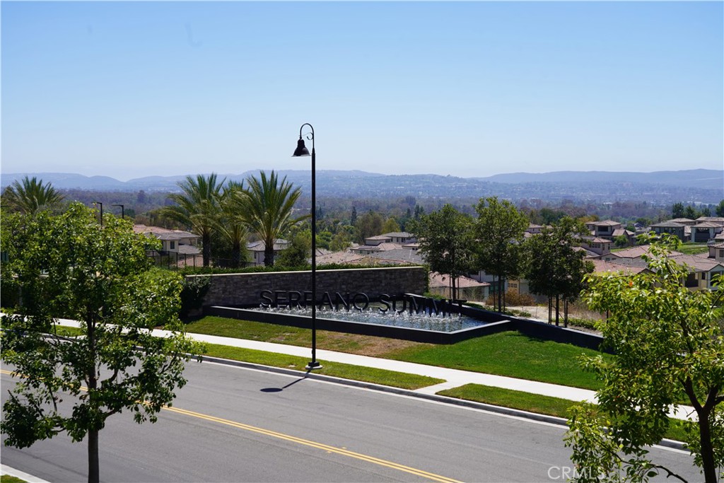 263 Carmona Lake Forest, CA 92630 - Photo 15 of 15 a view of a terrace with a bench and trees