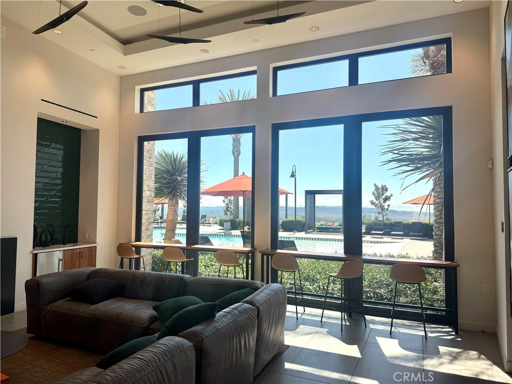 263 Carmona Lake Forest, CA 92630 - Photo 8 of 15 a living room with furniture and a floor to ceiling window