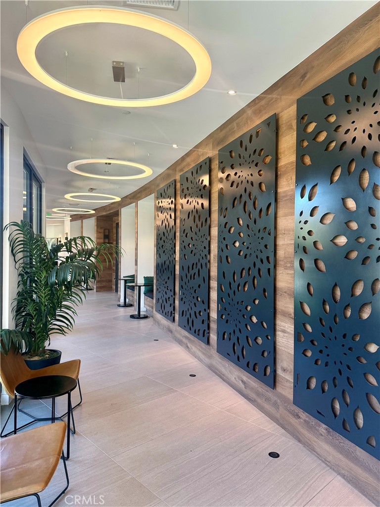 263 Carmona Lake Forest, CA 92630 - Photo 9 of 15 a very nice looking room with a large window and potted plants