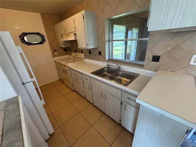 a bathroom with a sink and a large mirror