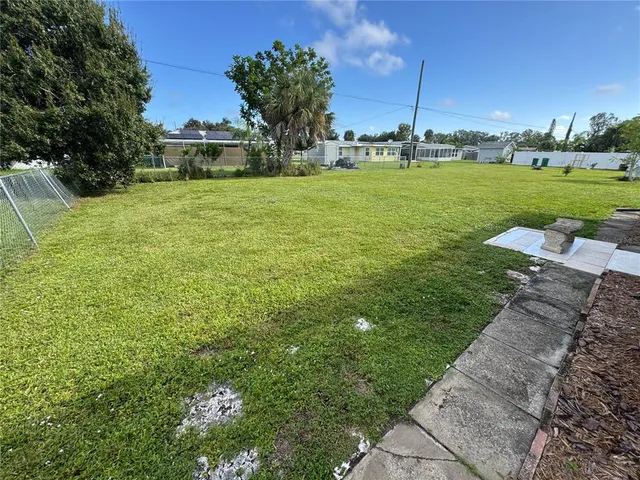 a view of a golf course with a yard