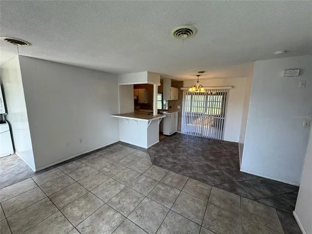 a kitchen with a sink a stove and cabinets
