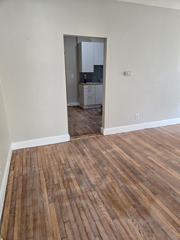 654 Metropolitan Avenue, Unit 4 Boston, MA 02136 - Photo 14 of 16 a view of a kitchen from the hallway
