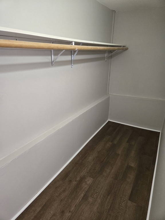 654 Metropolitan Avenue, Unit 4 Boston, MA 02136 - Photo 8 of 16 a view of a room with rack on the wall