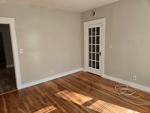 a view of a livingroom with wooden floor