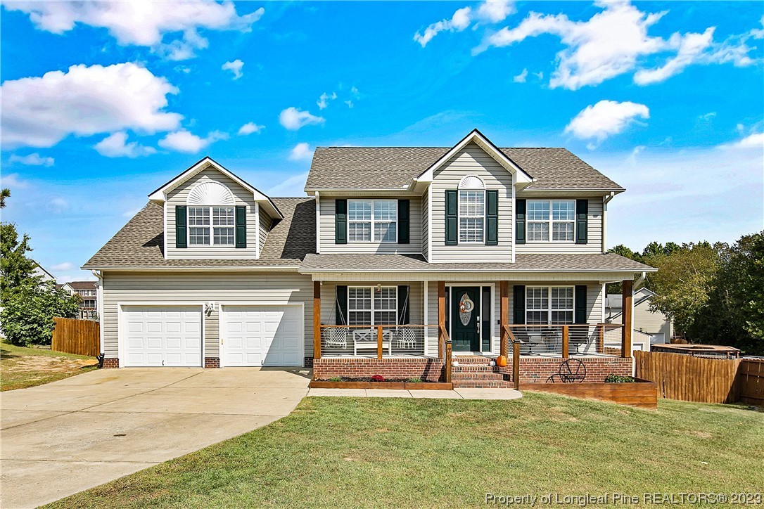a front view of a house with a yard table and chairs