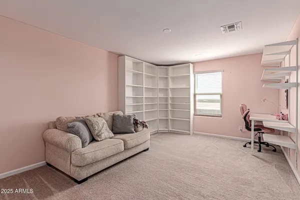 a spacious bedroom with a bed and a walk in closet