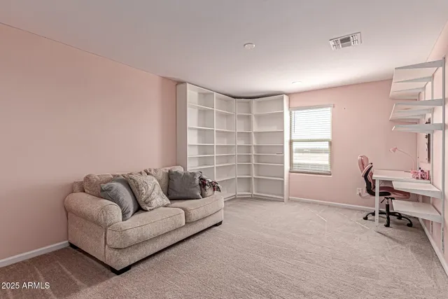 a spacious bedroom with a bed and a walk in closet