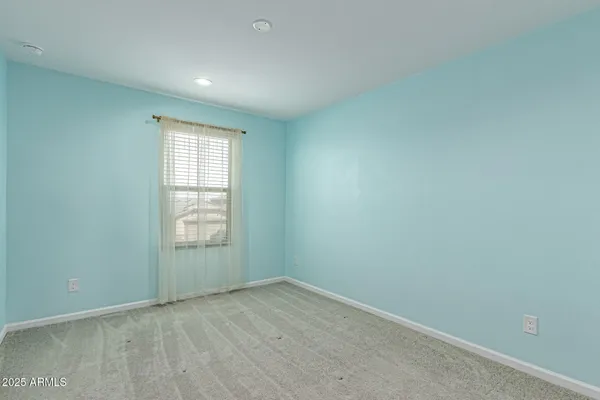 an empty room with closet area