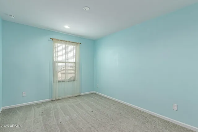 an empty room with closet area