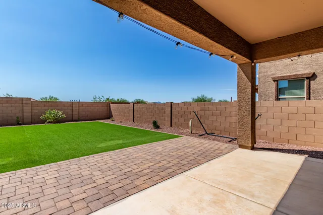 a view of a backyard with an outdoor space