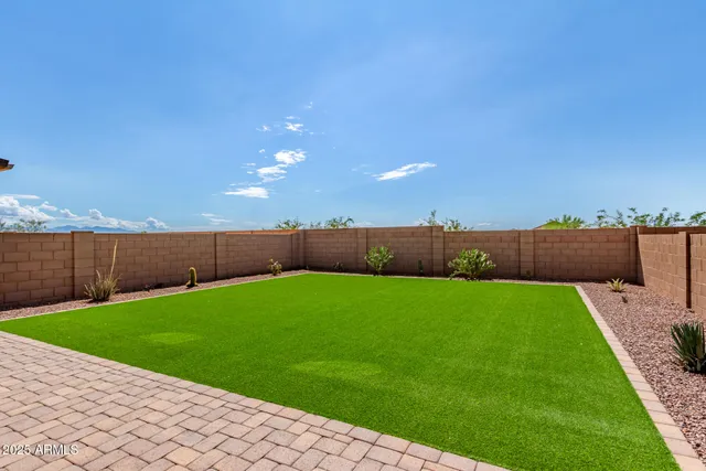 a view of a backyard with an outdoor space