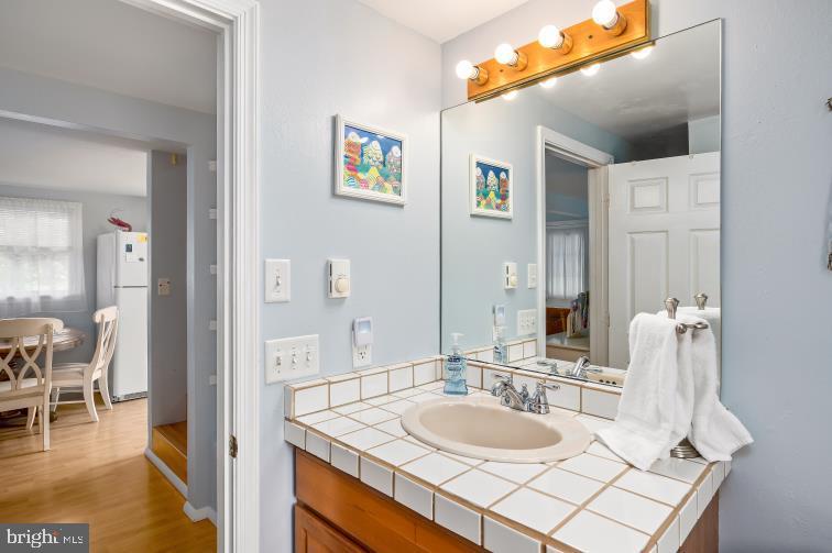32789 Cedar Drive Ocean View, DE 19970 - Photo 12 of 18 a bathroom with a sink and a mirror