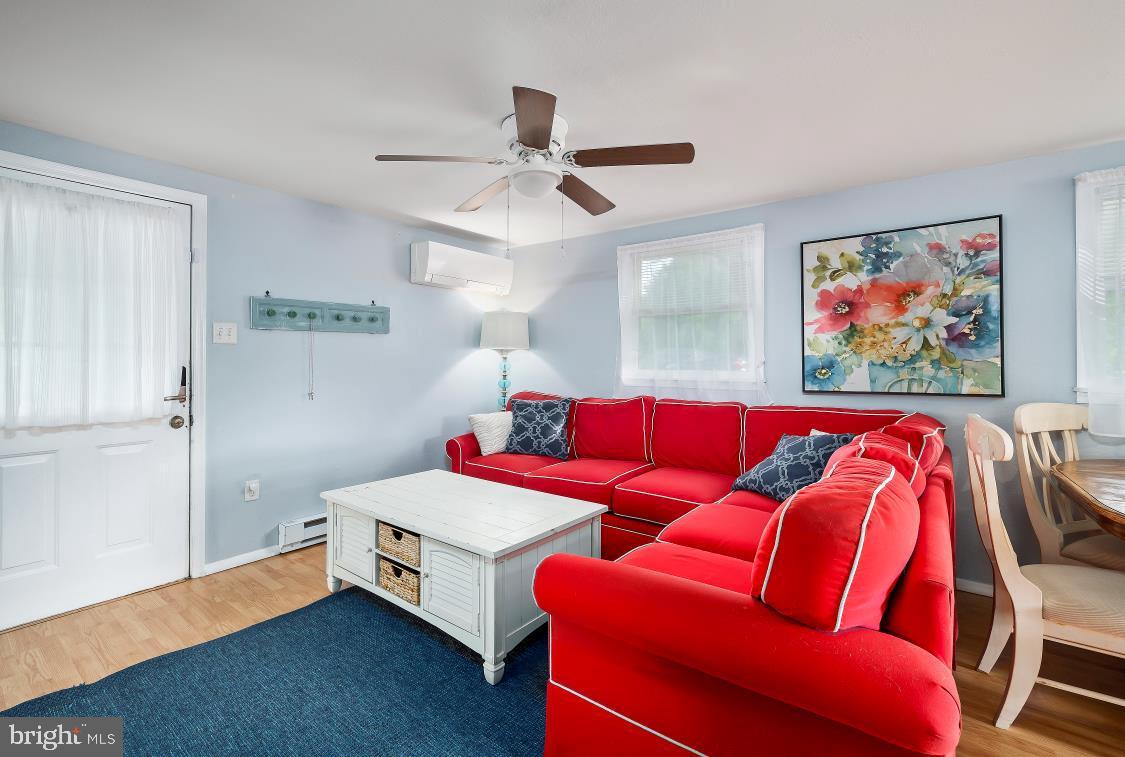 32789 Cedar Drive Ocean View, DE 19970 - Photo 5 of 18 a living room with furniture and a ceiling fan