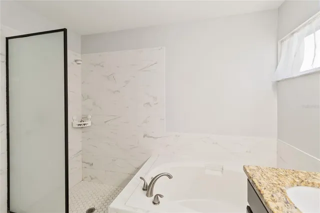 a view of a kitchen with a sink and a window