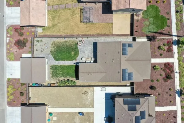 an aerial view of residential houses with outdoor space