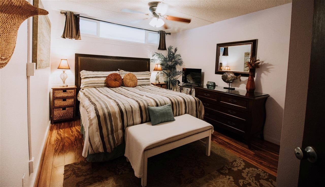 2531 South Kihei Road, Unit D210 Kihei, HI 96753 - Photo 12 of 23 a bedroom with a bed and a dresser