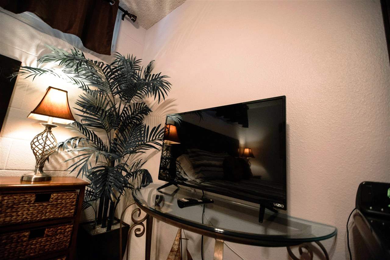 2531 South Kihei Road, Unit D210 Kihei, HI 96753 - Photo 14 of 23 a living room with furniture and a flat screen tv