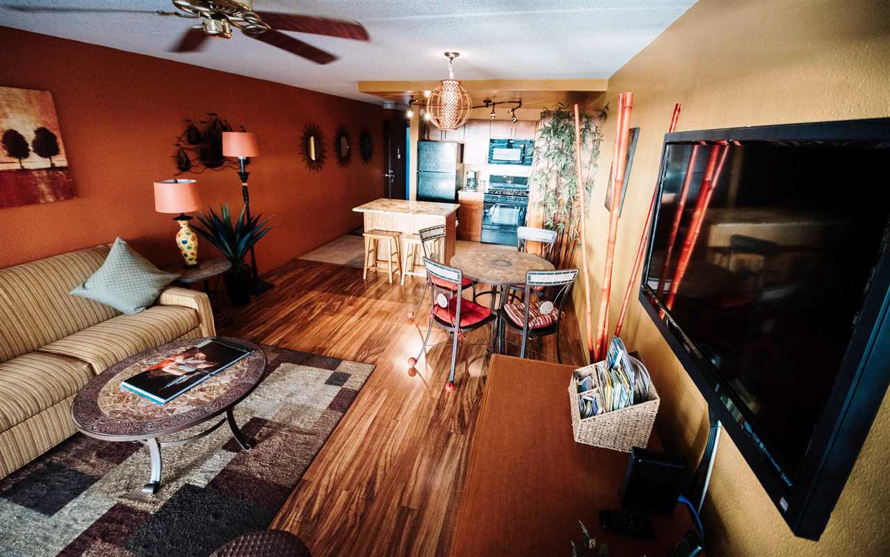 2531 South Kihei Road, Unit D210 Kihei, HI 96753 - Photo 5 of 23 a living room with furniture and a flat screen tv