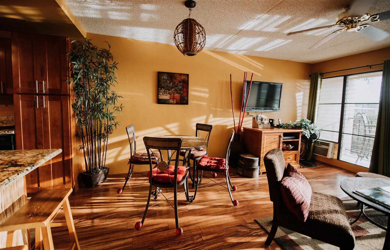 2531 South Kihei Road, Unit D210 Kihei, HI 96753 - Photo 7 of 23 a view of a dining room with furniture window and wooden floor