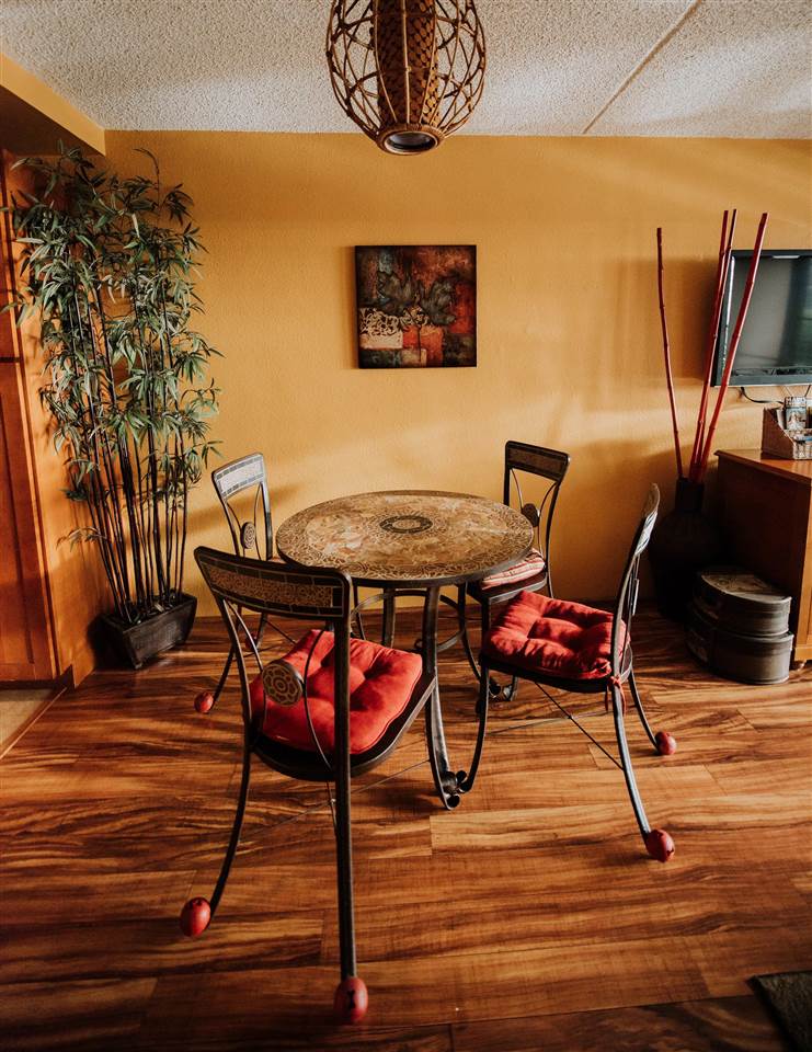 2531 South Kihei Road, Unit D210 Kihei, HI 96753 - Photo 9 of 23 a view of a dining room with furniture and wooden floor