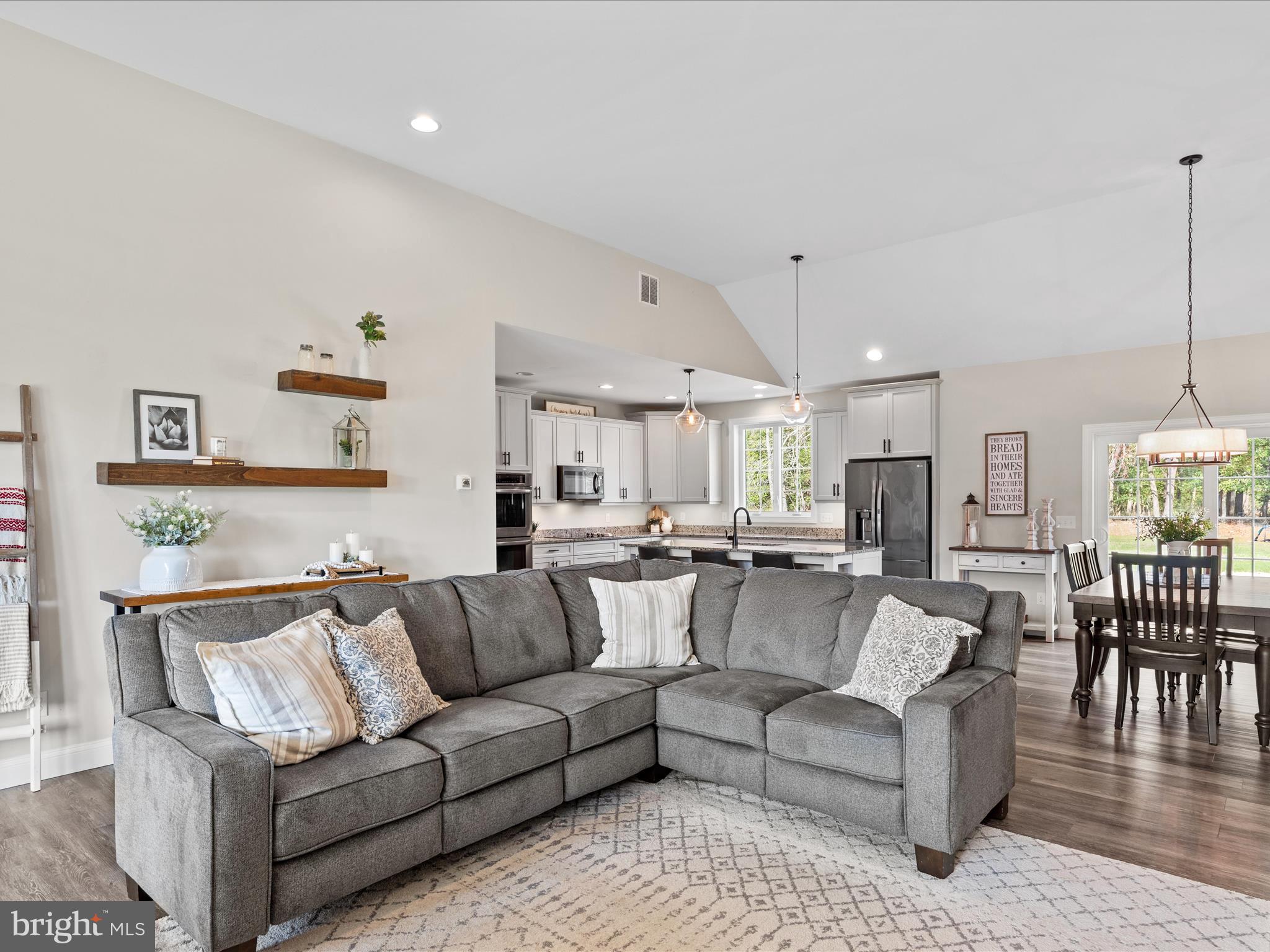 20355 Cool Spring Road Milton, DE 19968 - Photo 11 of 54 a view of living room kitchen with furniture and wooden floor