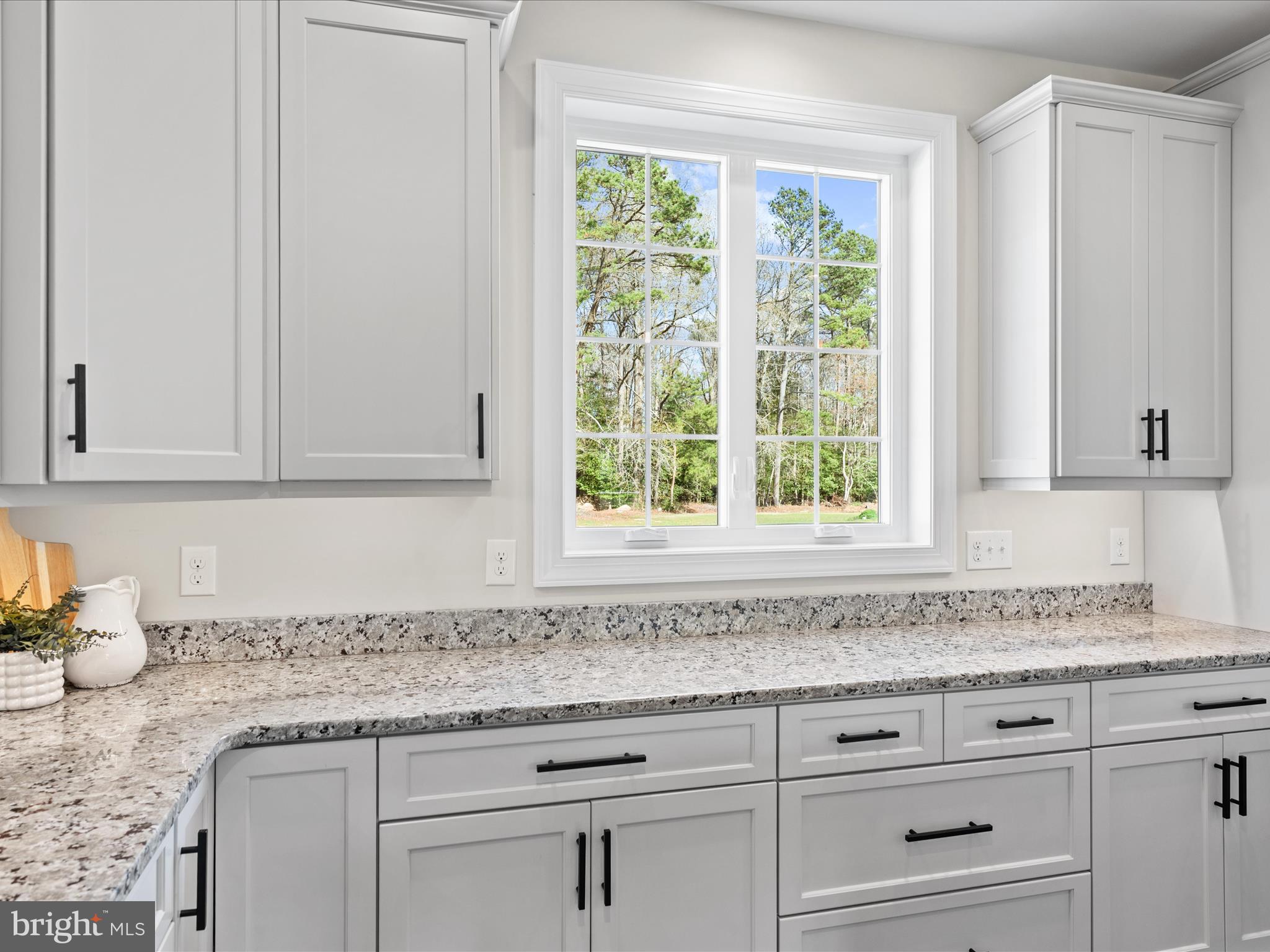 20355 Cool Spring Road Milton, DE 19968 - Photo 15 of 54 a kitchen with granite countertop cabinets and window