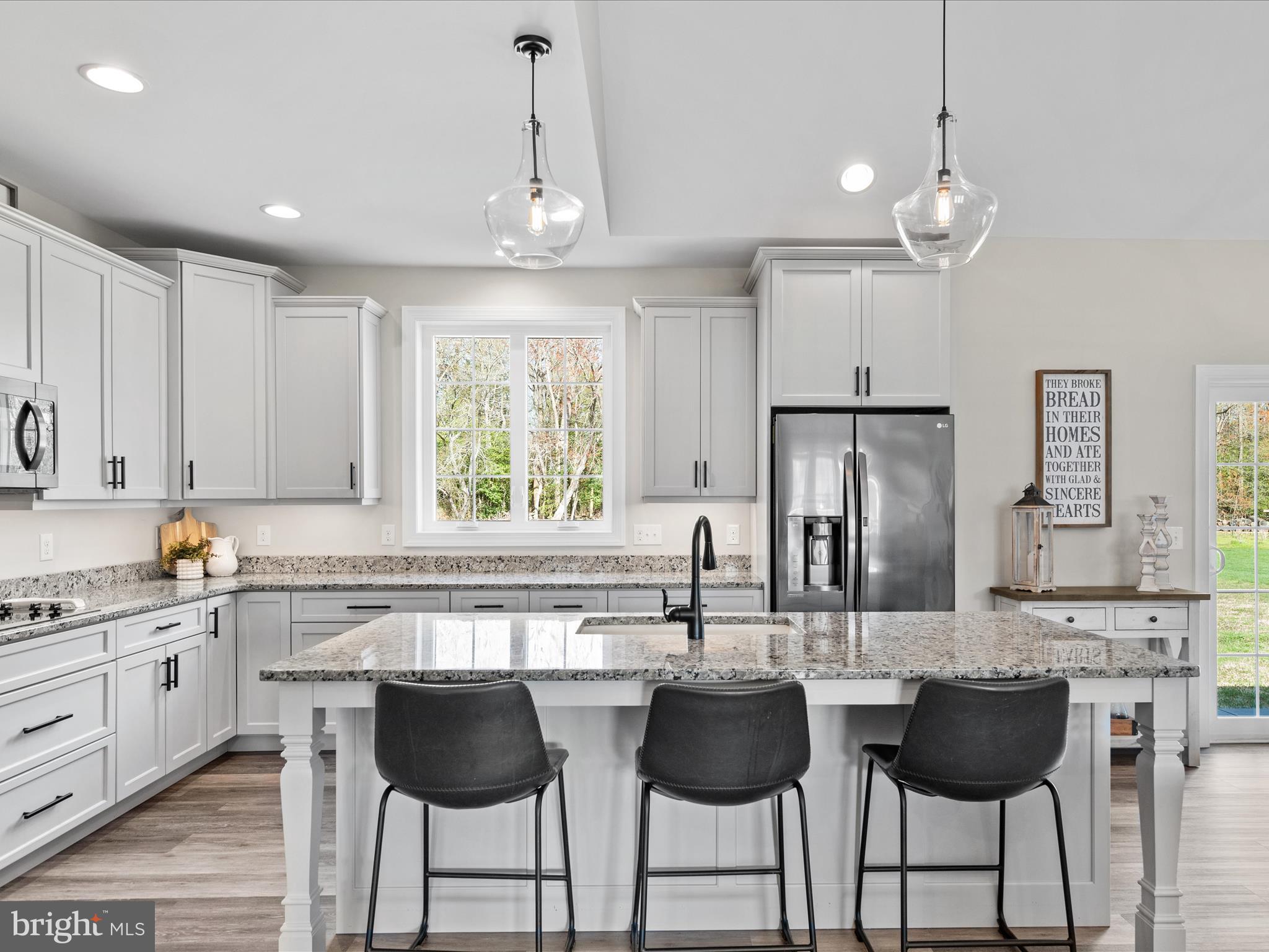20355 Cool Spring Road Milton, DE 19968 - Photo 16 of 54 a kitchen with granite countertop a counter space chairs stainless steel appliances and cabinets