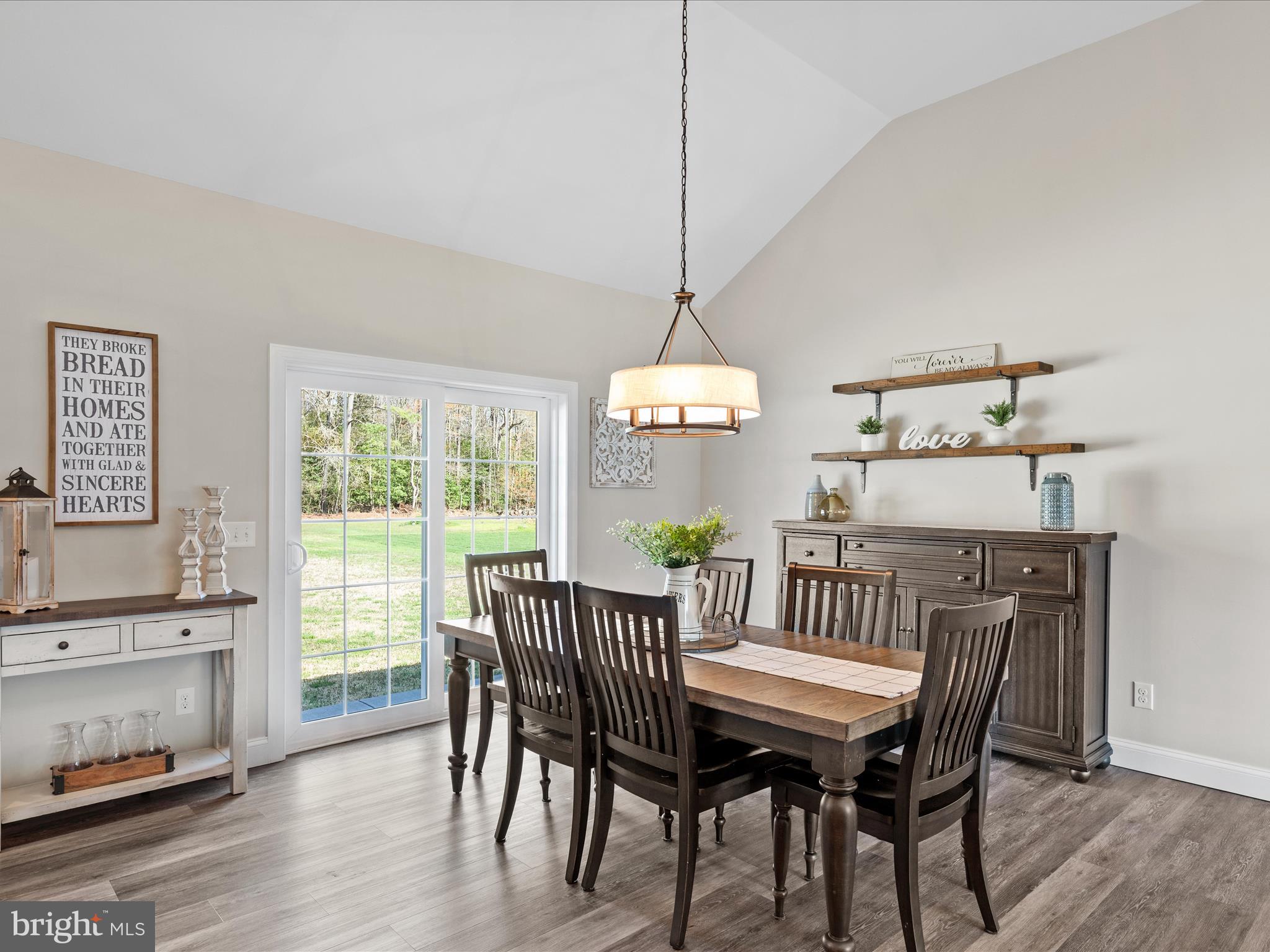 20355 Cool Spring Road Milton, DE 19968 - Photo 22 of 54 a view of a dining room with furniture window and wooden floor