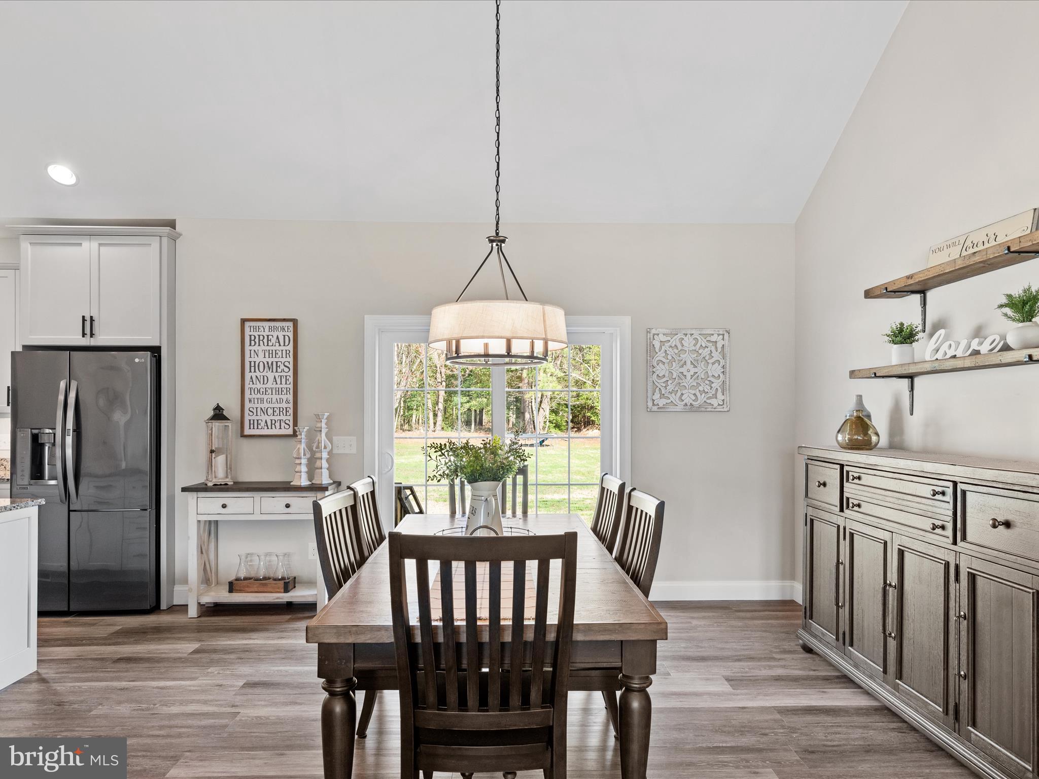 20355 Cool Spring Road Milton, DE 19968 - Photo 24 of 54 a view of a dining room with furniture window and wooden floor