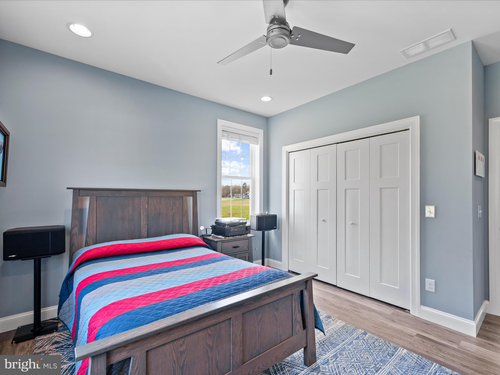 20355 Cool Spring Road Milton, DE 19968 - Photo 35 of 54 a bedroom with a bed and a chandelier