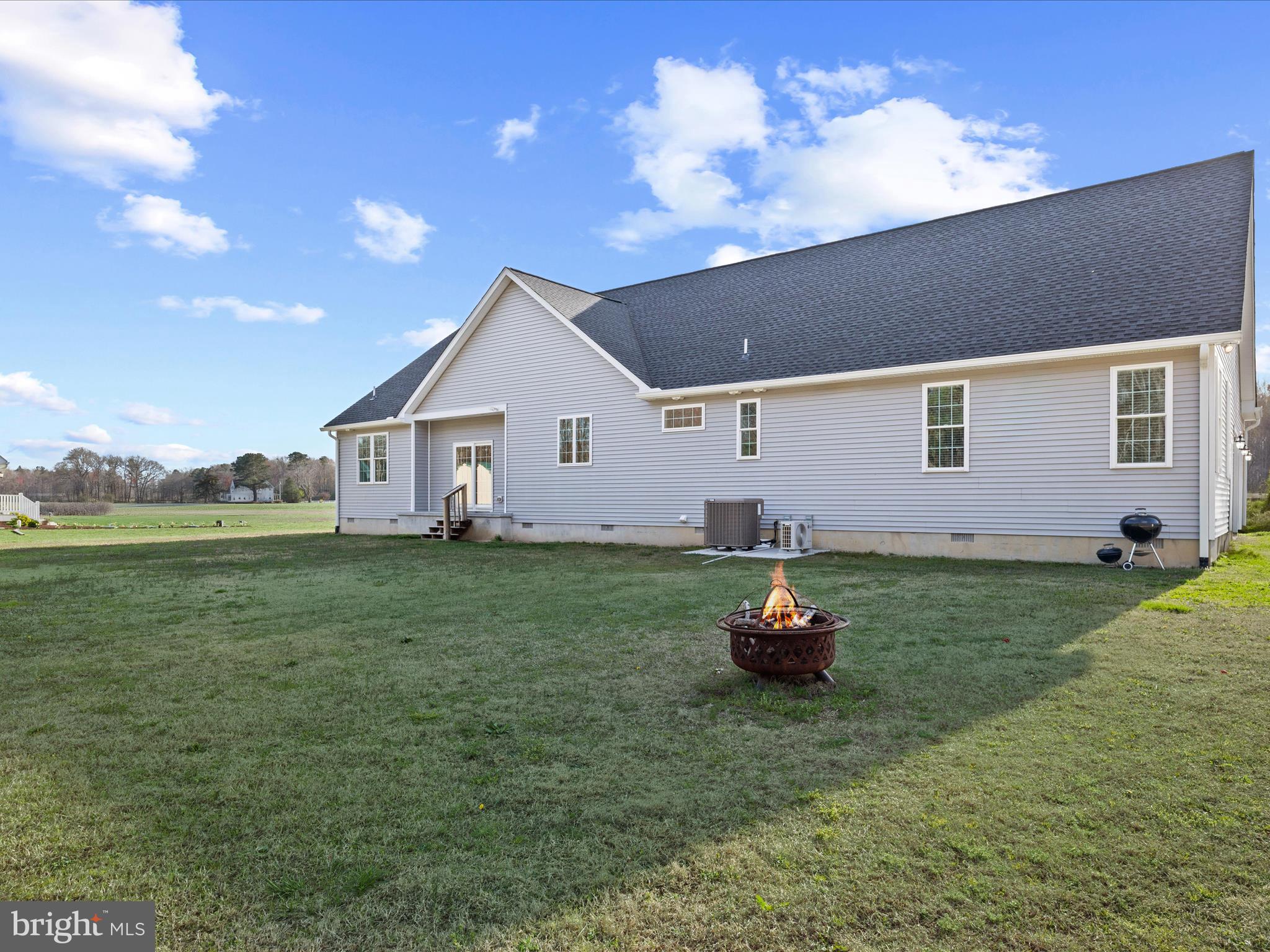 20355 Cool Spring Road Milton, DE 19968 - Photo 48 of 54 a front view of a house with a garden