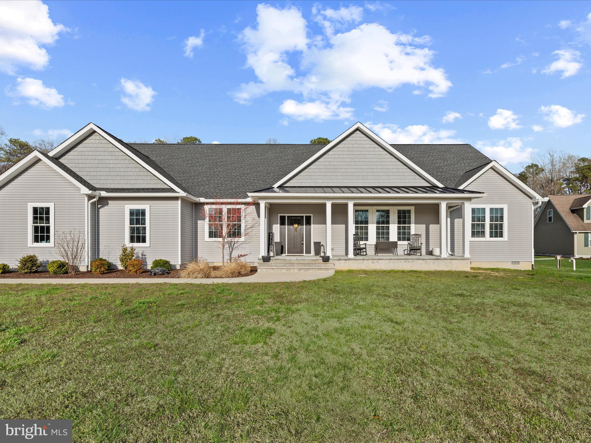 20355 Cool Spring Road Milton, DE 19968 - Photo 51 of 54 a front view of a house with a garden