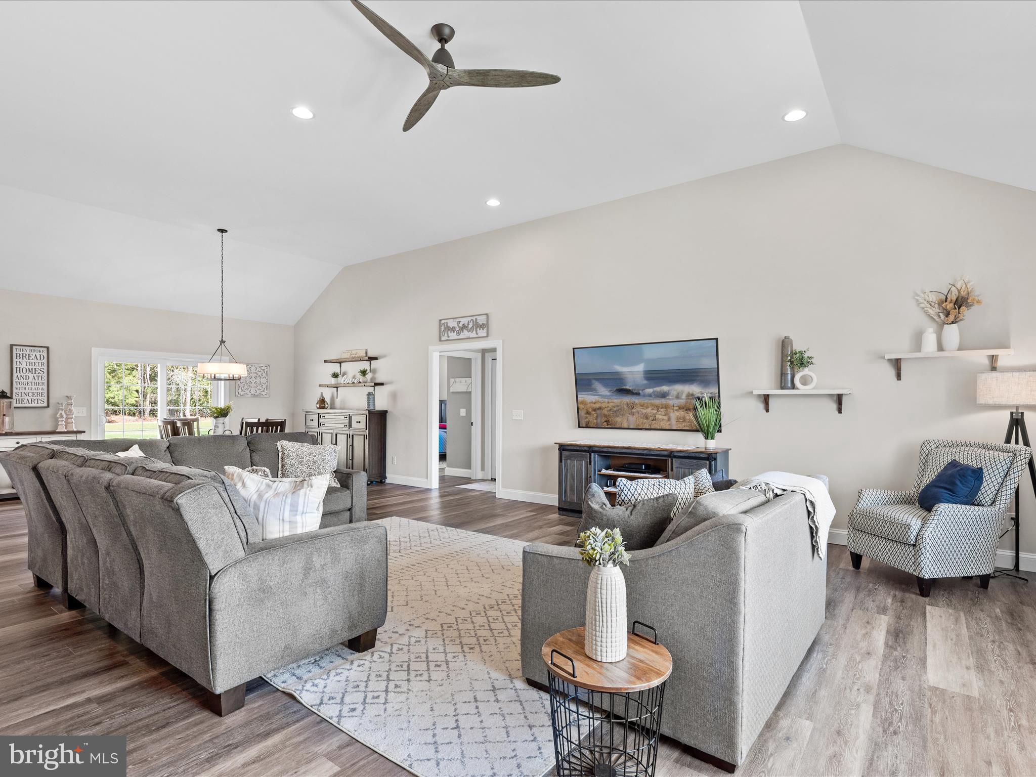 20355 Cool Spring Road Milton, DE 19968 - Photo 6 of 54 a living room with furniture and a flat screen tv