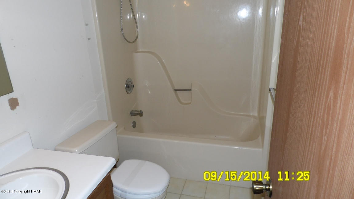 216 Falls Circle Bushkill, PA 18324 - Photo 5 of 11 a bathroom with a toilet and a shower