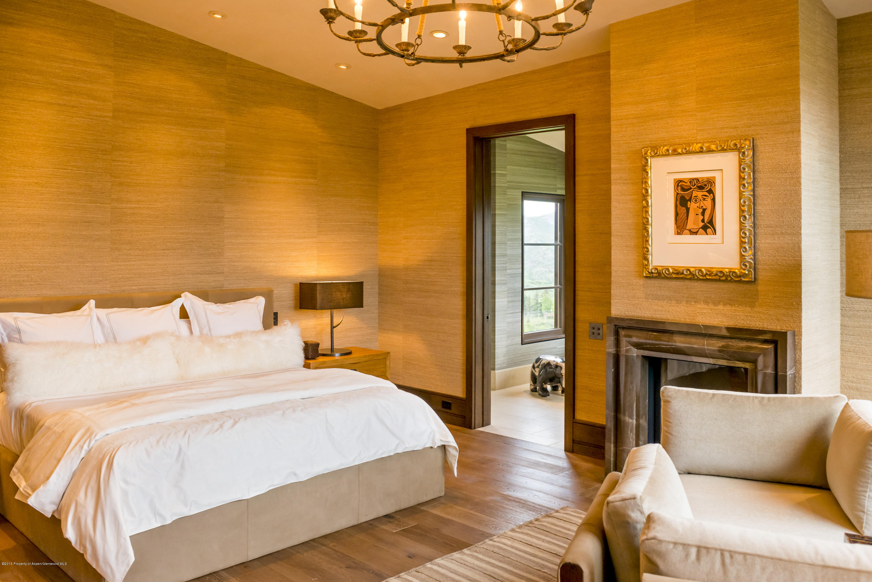 101 Oak Ridge Drive Aspen, CO 81611 - Photo 11 of 18 a bedroom with a bed and wooden floor