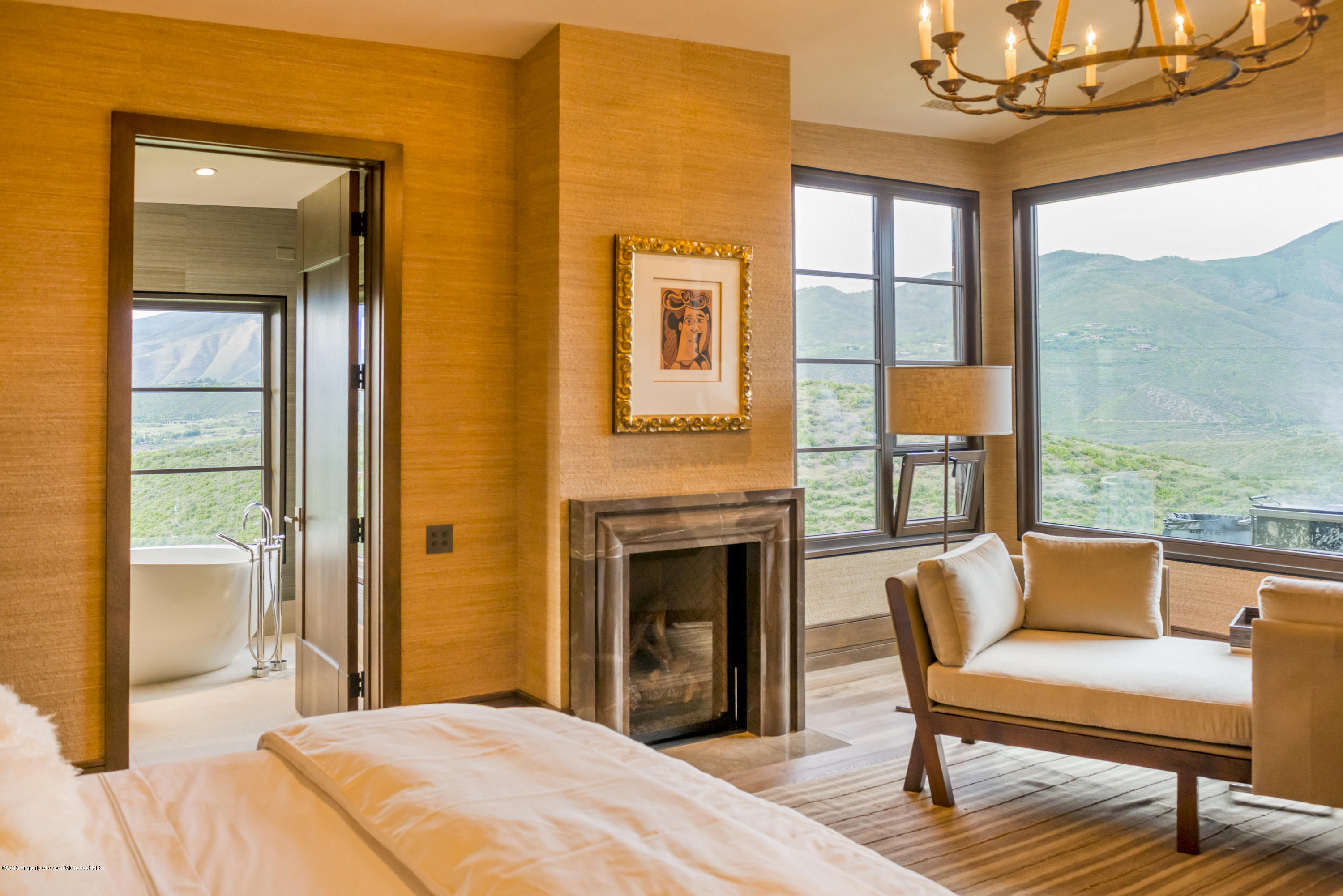 101 Oak Ridge Drive Aspen, CO 81611 - Photo 12 of 18 a bedroom with a bed and wooden floor
