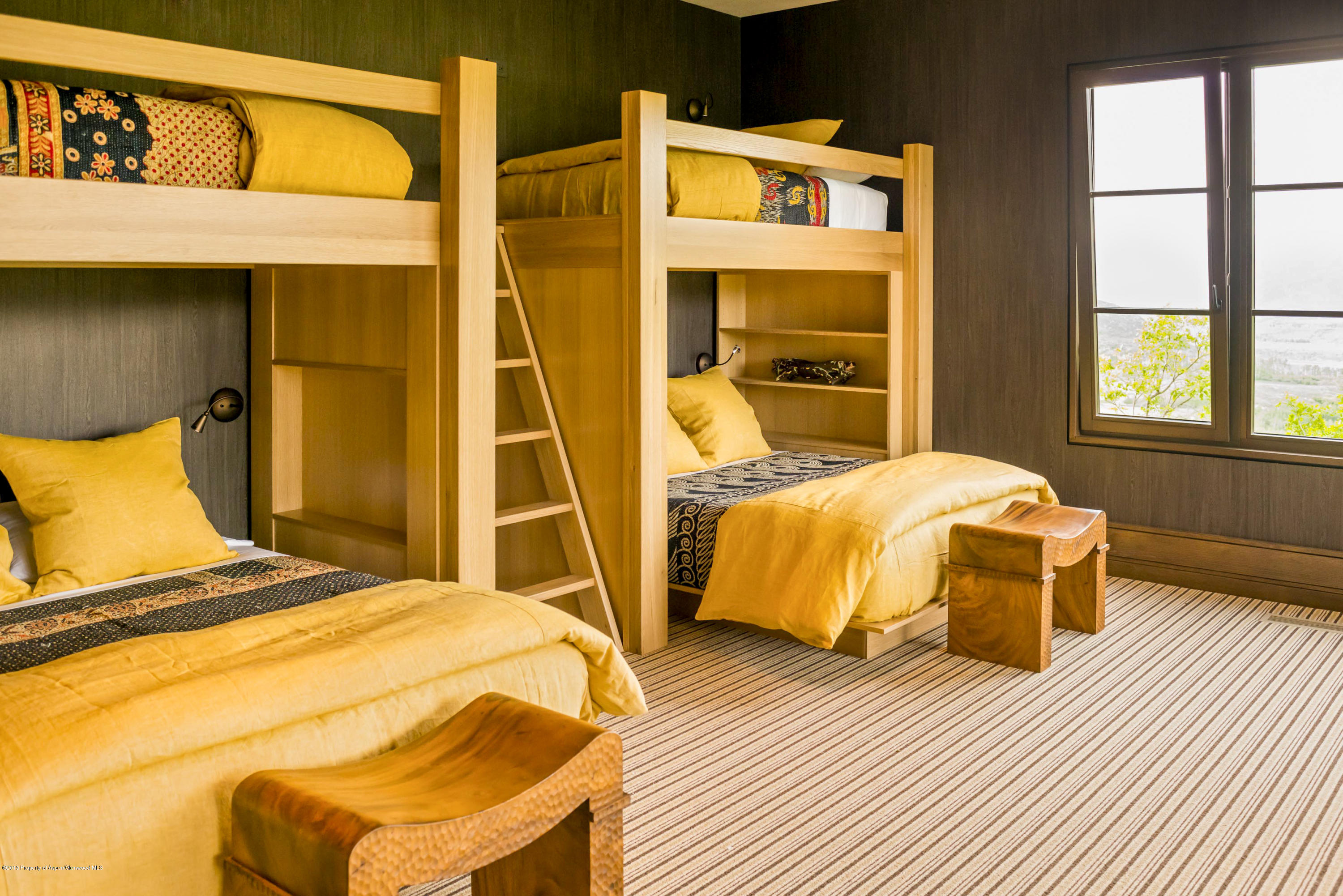 101 Oak Ridge Drive Aspen, CO 81611 - Photo 14 of 18 a bedroom with a bed and wooden floor